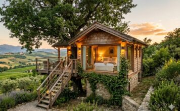 Casa sull’albero in Italia: le 20 migliori strutture dove dormire Casa sull'albero in Italia immersa nella natura con colline sullo sfondo